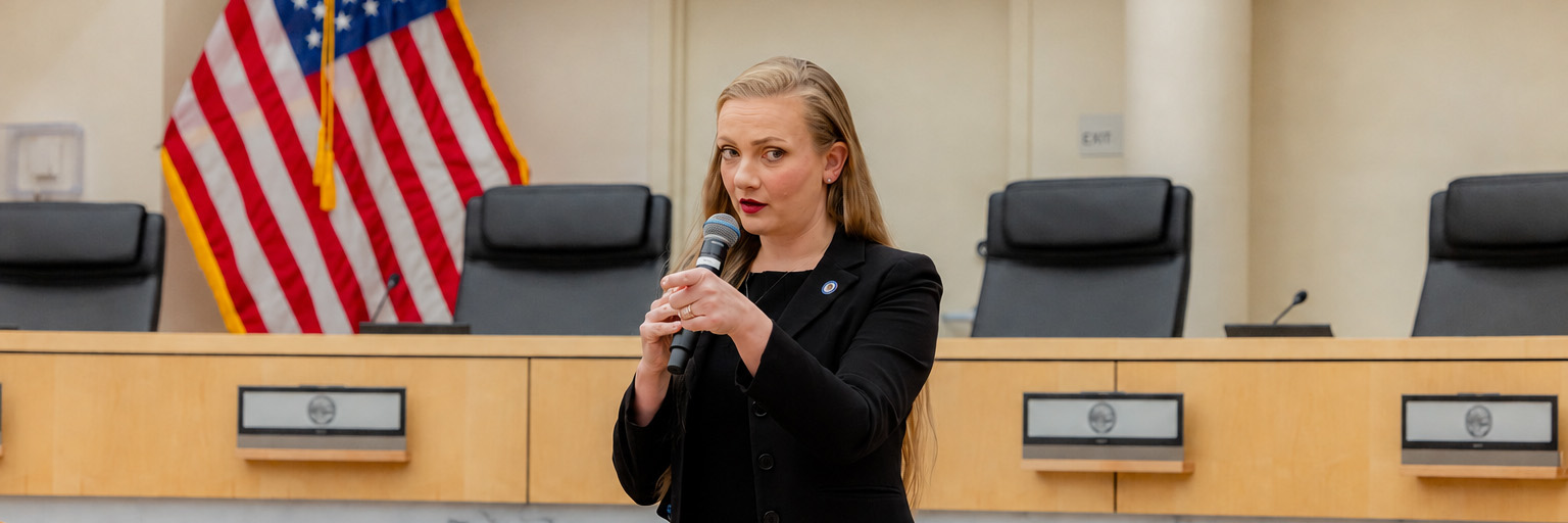 Kaylynn Paxson speaking at the City Council dais at Corpus Christi City Hall